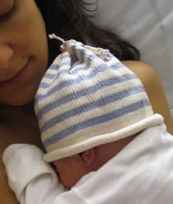 A Mother and a Newborn in Cap